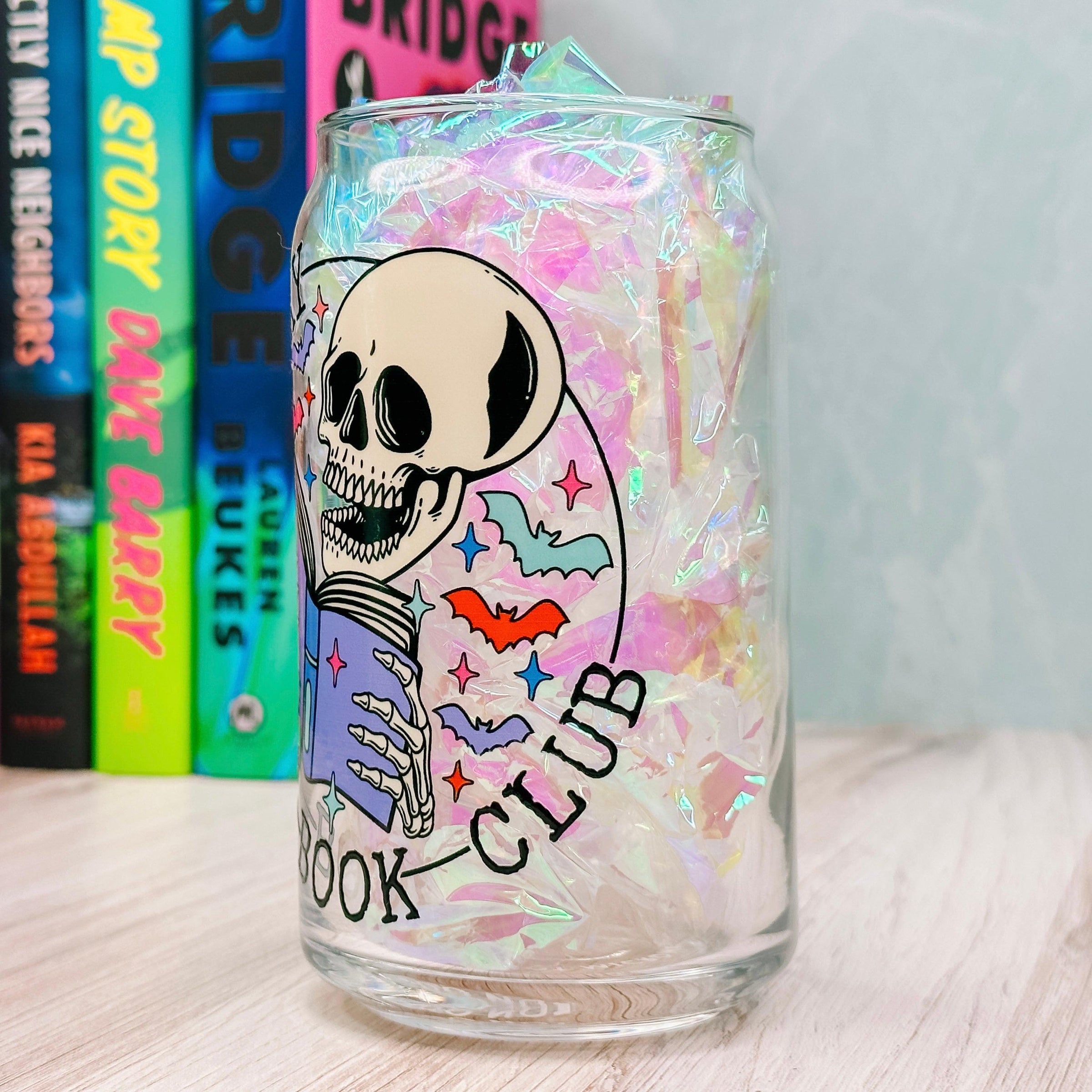 https://www.cricketpaperco.com/cdn/shop/files/Spooky-Book-Club-16oz-Libbey-Glass-Can-Cup-3_2400x.jpg?v=1702382250